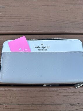 kate spade two-tone light blue and white zip wallet with gold logo